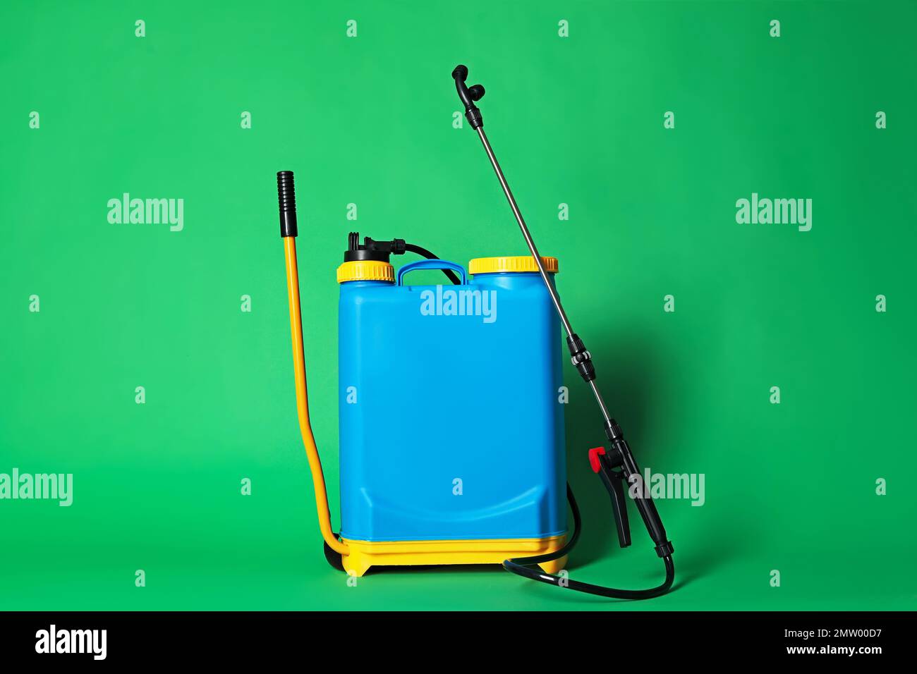 Manual insecticide sprayer on green background. Pest control Stock ...