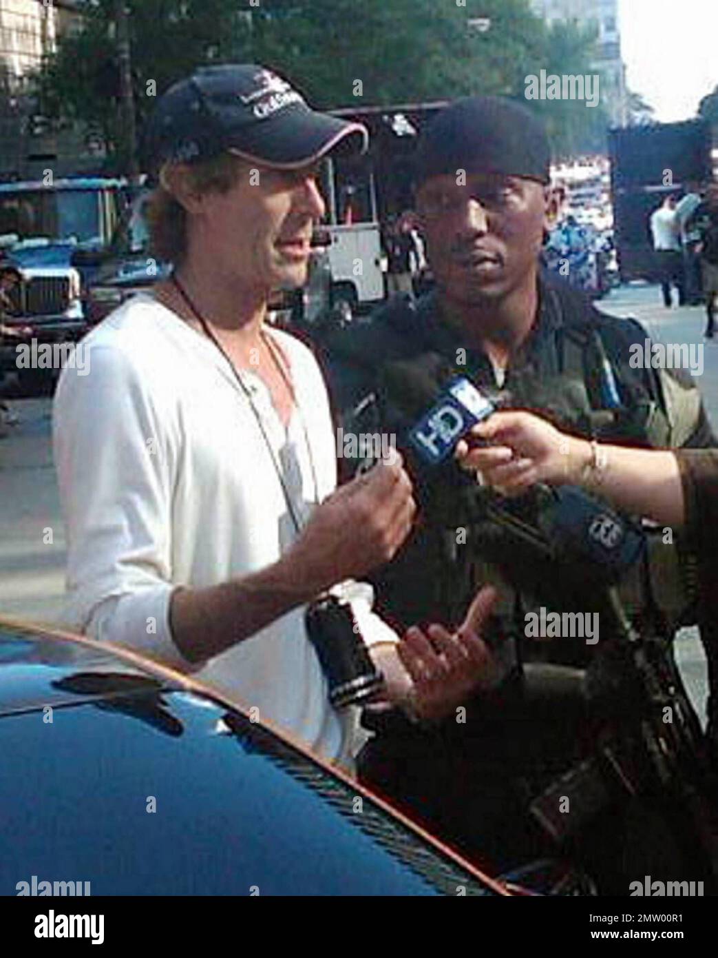 Director Michael Bay and actor Tyrese Gibson talk with the media during a break from filming on the Chicago set of 'Transformers 3'.  Bay, who is rumored to be difficult on set, thanked fans who came out to support them despite the summer heat. Chicago, IL. 07/18/10. Stock Photo