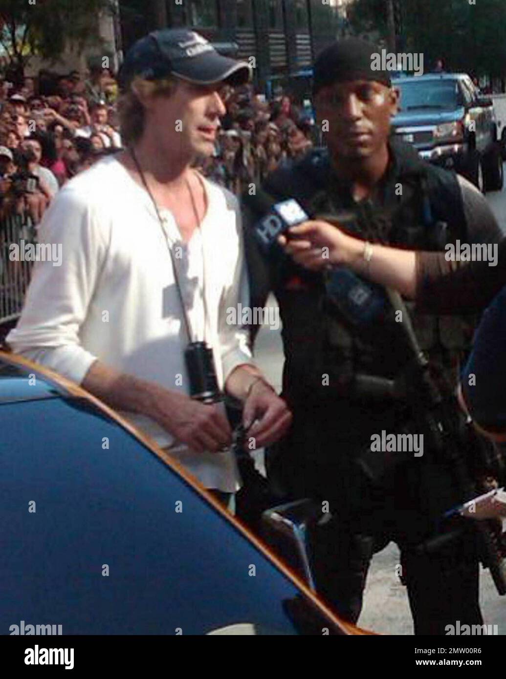 Director Michael Bay and actor Tyrese Gibson talk with the media during a break from filming on the Chicago set of 'Transformers 3'.  Bay, who is rumored to be difficult on set, thanked fans who came out to support them despite the summer heat. Chicago, IL. 07/18/10.   . Stock Photo
