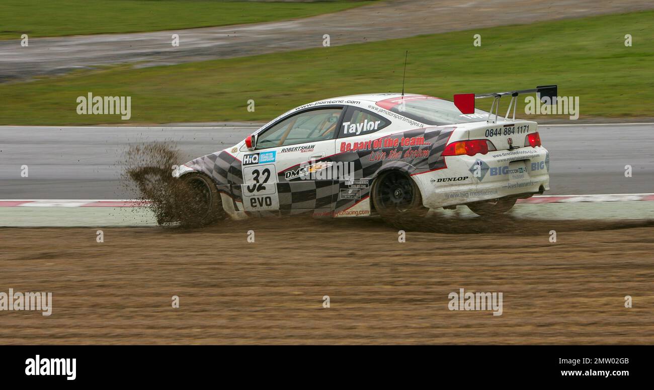 Alan Taylor goes wide off Paddock Hill bend into the gravel on a wet track at Brands Hatch driving the Honda Integra Type-R  during the BTCC 2008 championship race Stock Photo