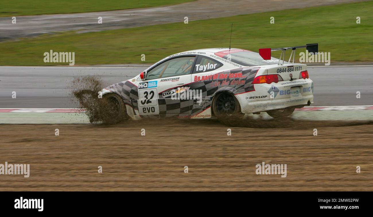 Alan Taylor goes wide off Paddock Hill bend into the gravel on a wet track at Brands Hatch driving the Honda Integra Type-R  during the BTCC 2008 championship race Stock Photo