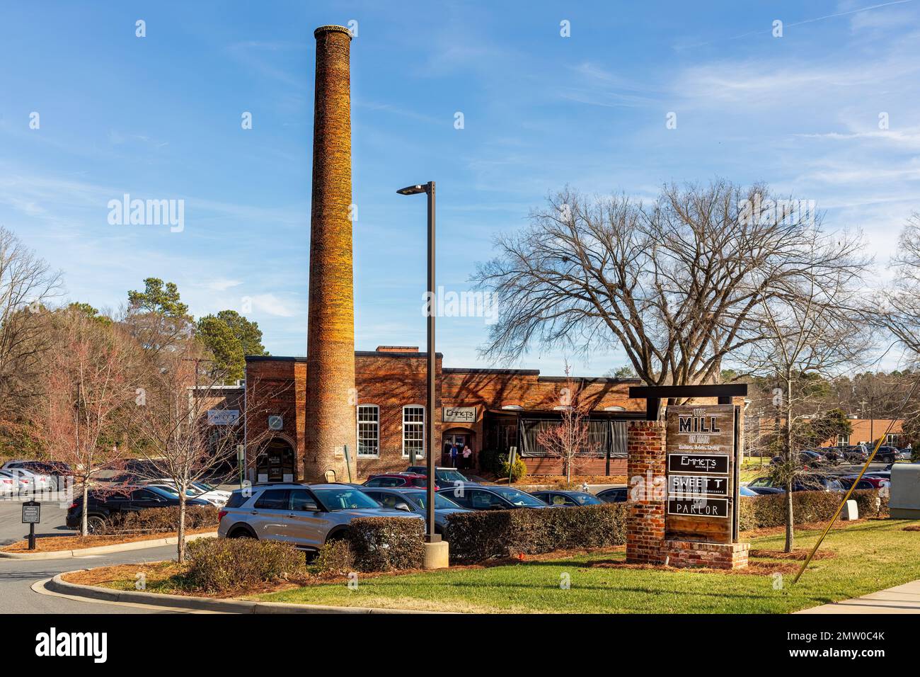 WAXHAW, NC, USA28 JAN 2023 Old mill with smokestack converted to