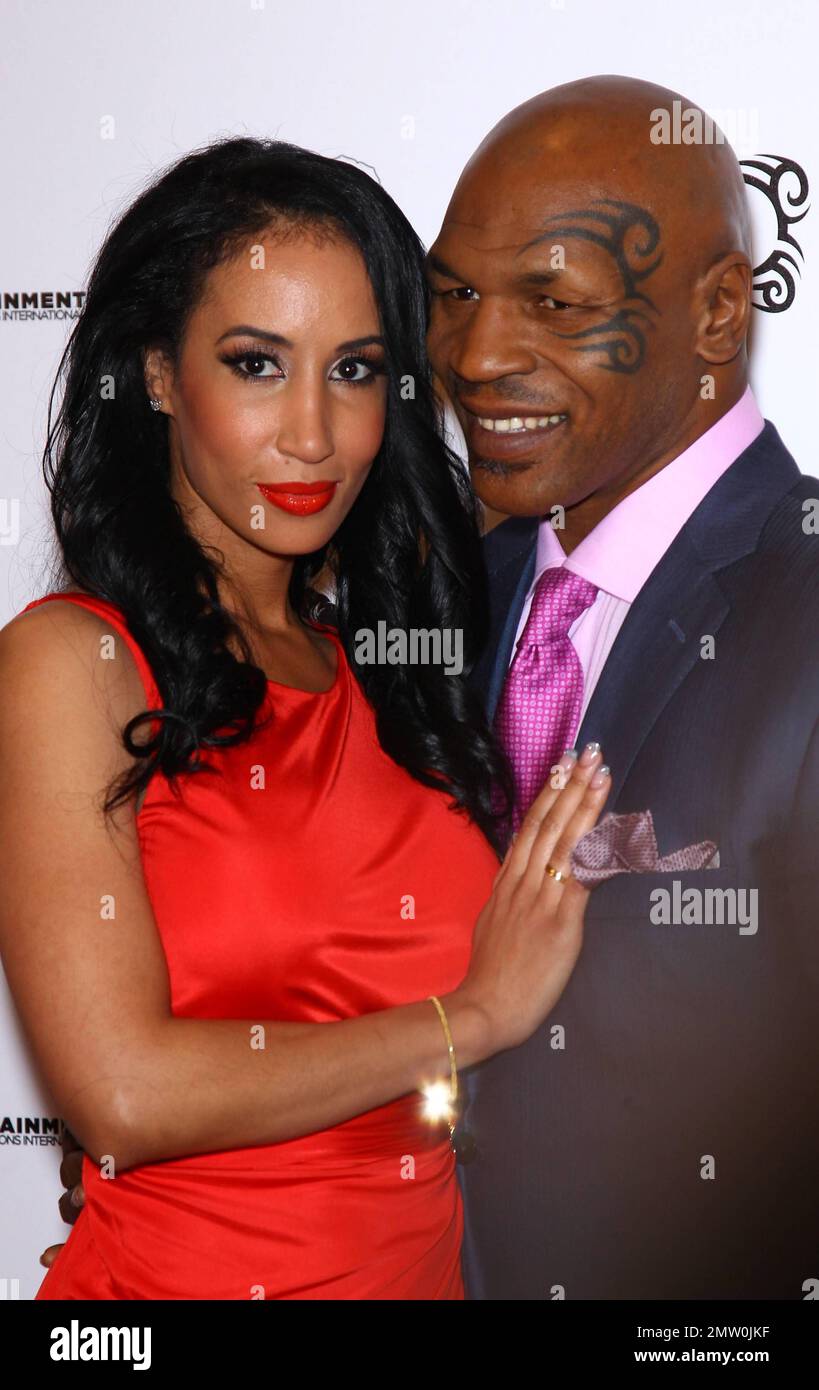 Mike Tyson and wife Lakiha Tyson at the grand opening of Tyson's one