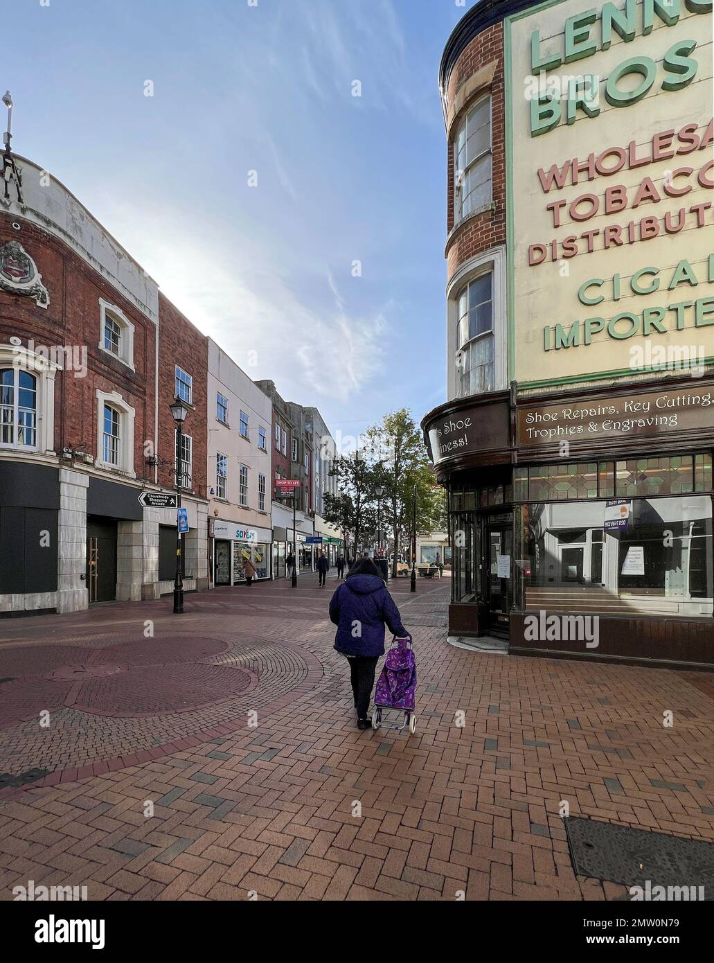 Rugby High Street, once busy with shoppers is now looking empty of shops and shoppers Stock