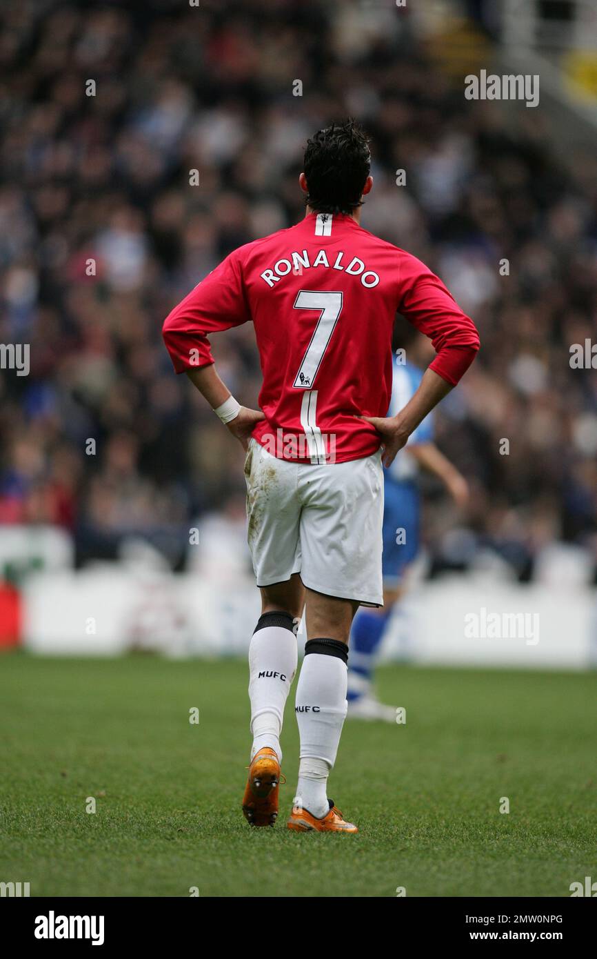 Back view of Cristiano Ronaldo with hands on hip in Manchester United kit showing name and number 7 playing in the premier league against Reading. Archive 19th January 2008. at the Madejski Stadium Reading.This image is bound by Dataco restrictions on how it can be used. EDITORIAL USE ONLY No use with unauthorised audio, video, data, fixture lists, club/league logos or “live” services. Online in-match use limited to 120 images, no video emulation. No use in betting, games or single club/league/player publications Stock Photo