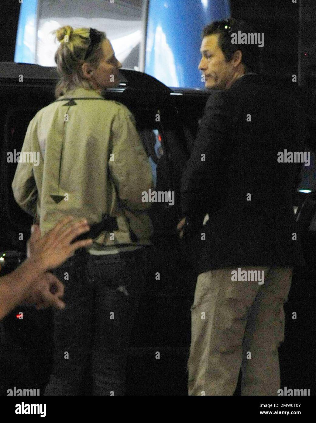 EXCLUSIVE!! Actress Uma Thurman, greeted off again, on again fiance Arpad Busson with a kiss at Miami Intl Airport arrivals. The couple called off their engagement in December 2009 after two years of dating but have obviously rekindled their romance.  Thurman has been filming her new movie, 'Bel Ami' recently opposite 'Twilight' star Robert Pattinson.  Miami, FL.  03/25/2010   . Stock Photo