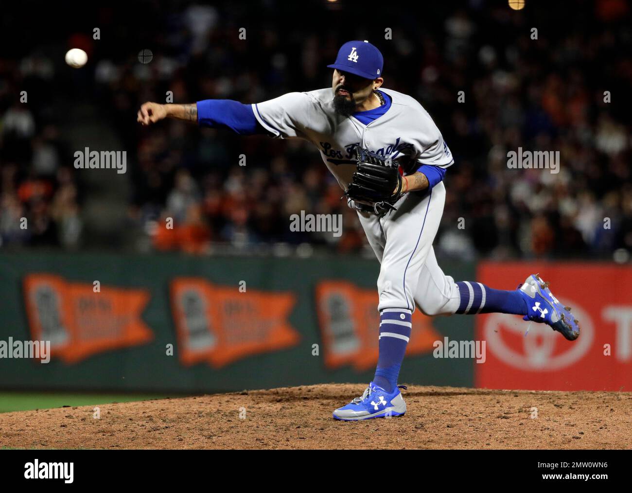Los Angeles Dodgers reliever Sergio Romo throws to the San Francisco ...
