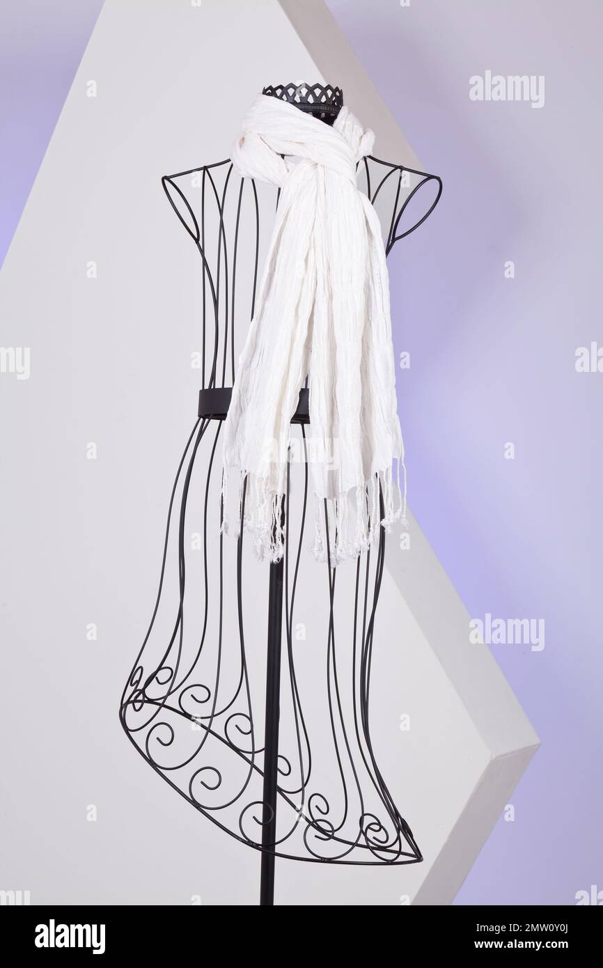 White Scarf Woven With Fringes On Mannequin. Stock Photo