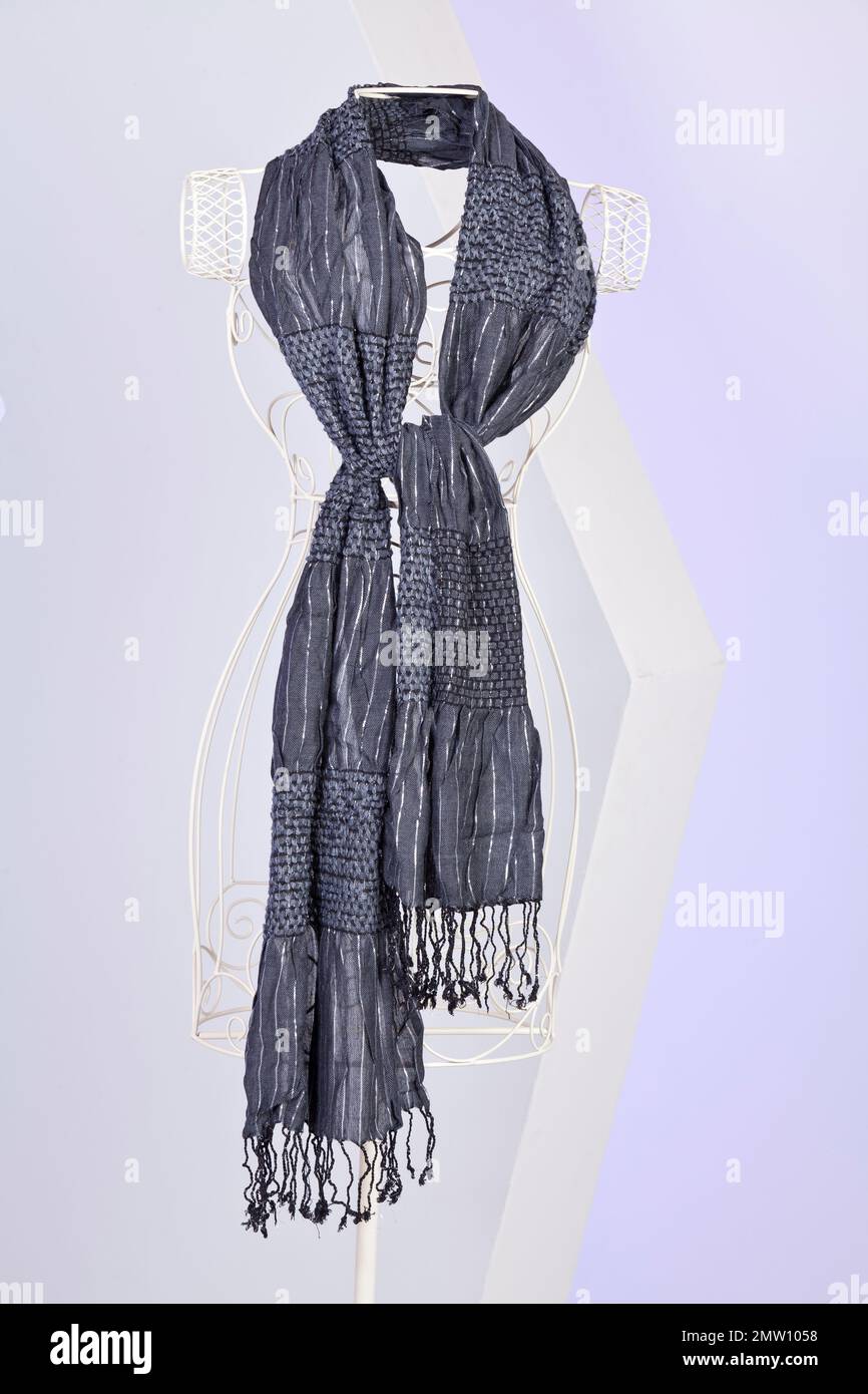 Grey Scarf Woven With Fringes On Mannequin. Stock Photo