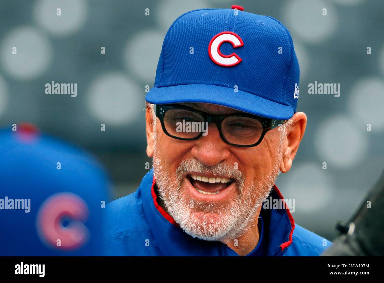 Chicago Cubs manager Joe Maddon watches batting practice before a