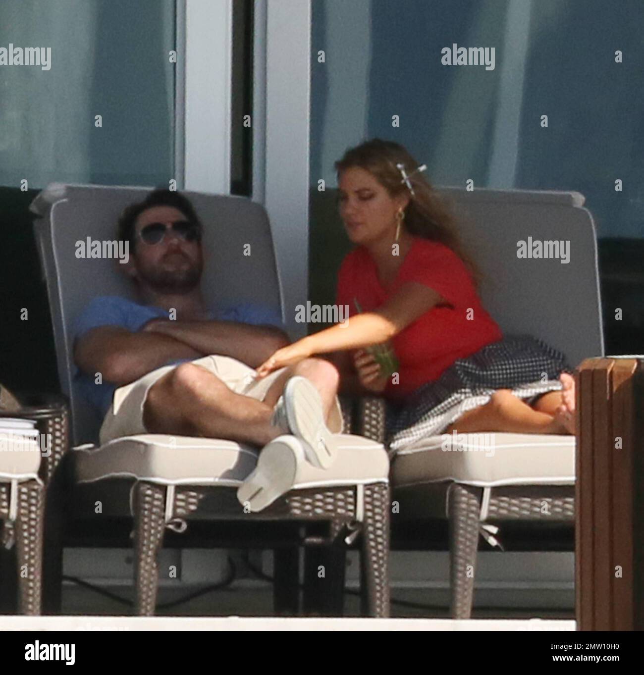 A color, born digital image of Justin Verlander #35 of the Houston Astros  smiling for a photo with his fiancé, American model and actress Kate Upton,  and the game worn jersey that