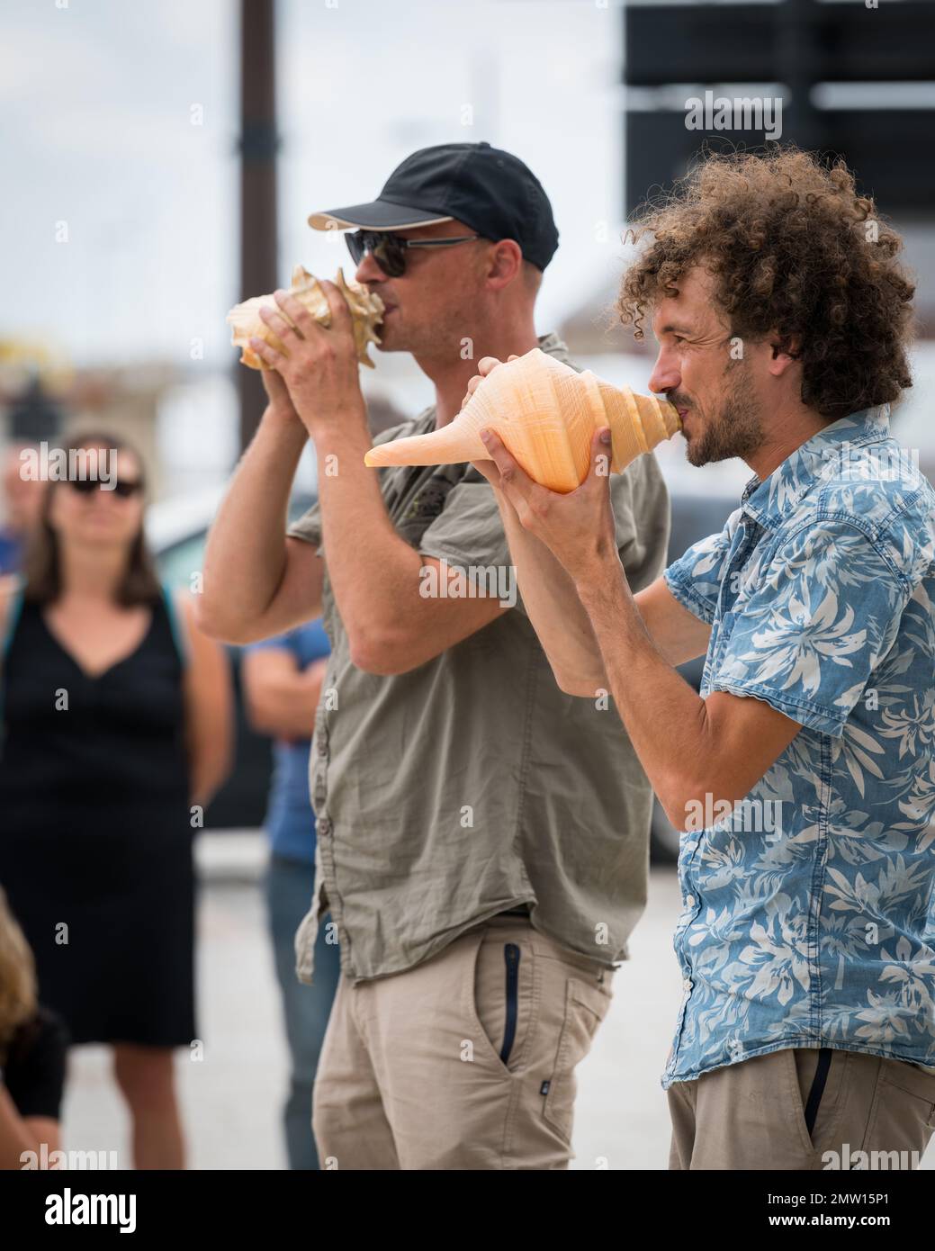 Saint Malo, France - August 11, 2018: Street musicians performing on conches, cloudy day in summer Stock Photo