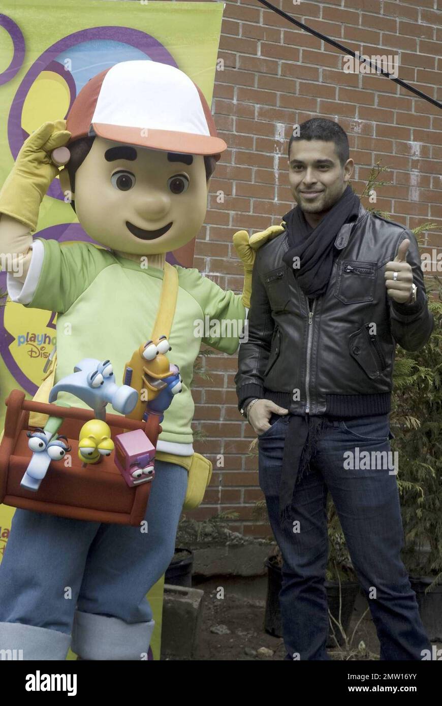 Actor Wilmer Valderrama, star of the Disney Channel's hit multicultural preschool series "Handy Manny," joins the Handy Manny character and kids from New York City's Earth School to plant a tree for Earth Day in the Generation X Garden on Manhattan's Lower East Side. In the hit series, Valderrama provides the voice for handyman Manny Garcia, a helpful, determined young man who, with the assistance of his eclectic set of talking tools, is the town's expert when it comes to repairing all that's not working, even friendships among neighbors. New York, NY. 4/15/09.    .  . Stock Photo