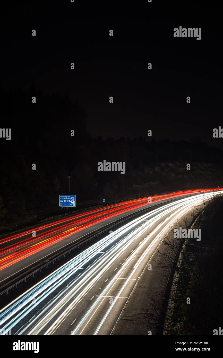 Light trails left by speeding traffic travelling through the night on ...