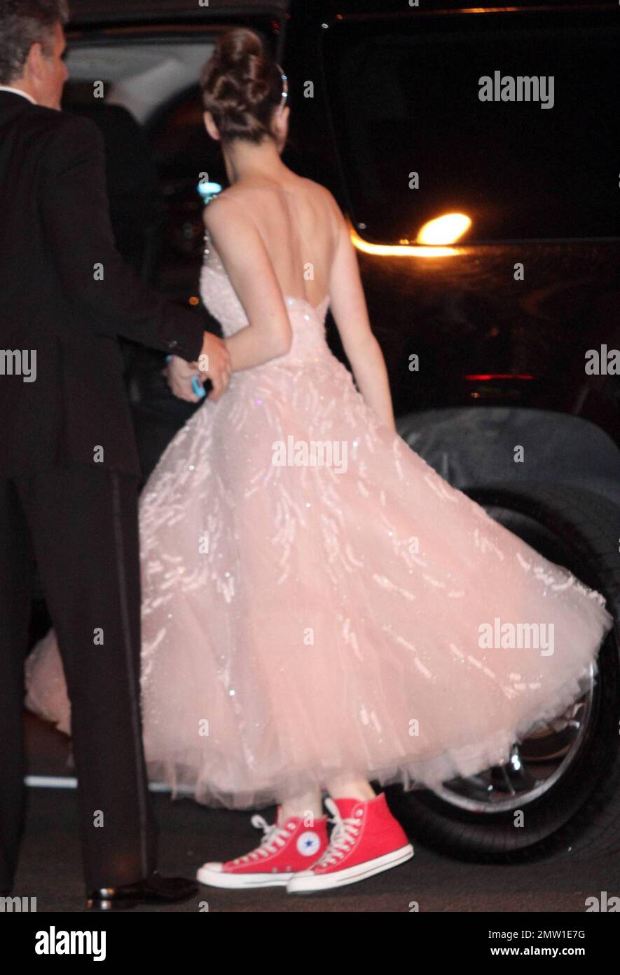 Young Academy Award nominee for Best Supporting Actress Hailee Steinfeld blows kisses to fans and wears a sweet princess dress with red Converse high top sneakers at the Vanity Fair Oscars after-party held at Sunset Tower Hotel following the 83rd Annual Academy Awards. Los Angeles, CA. 02/27/11. Stock Photo