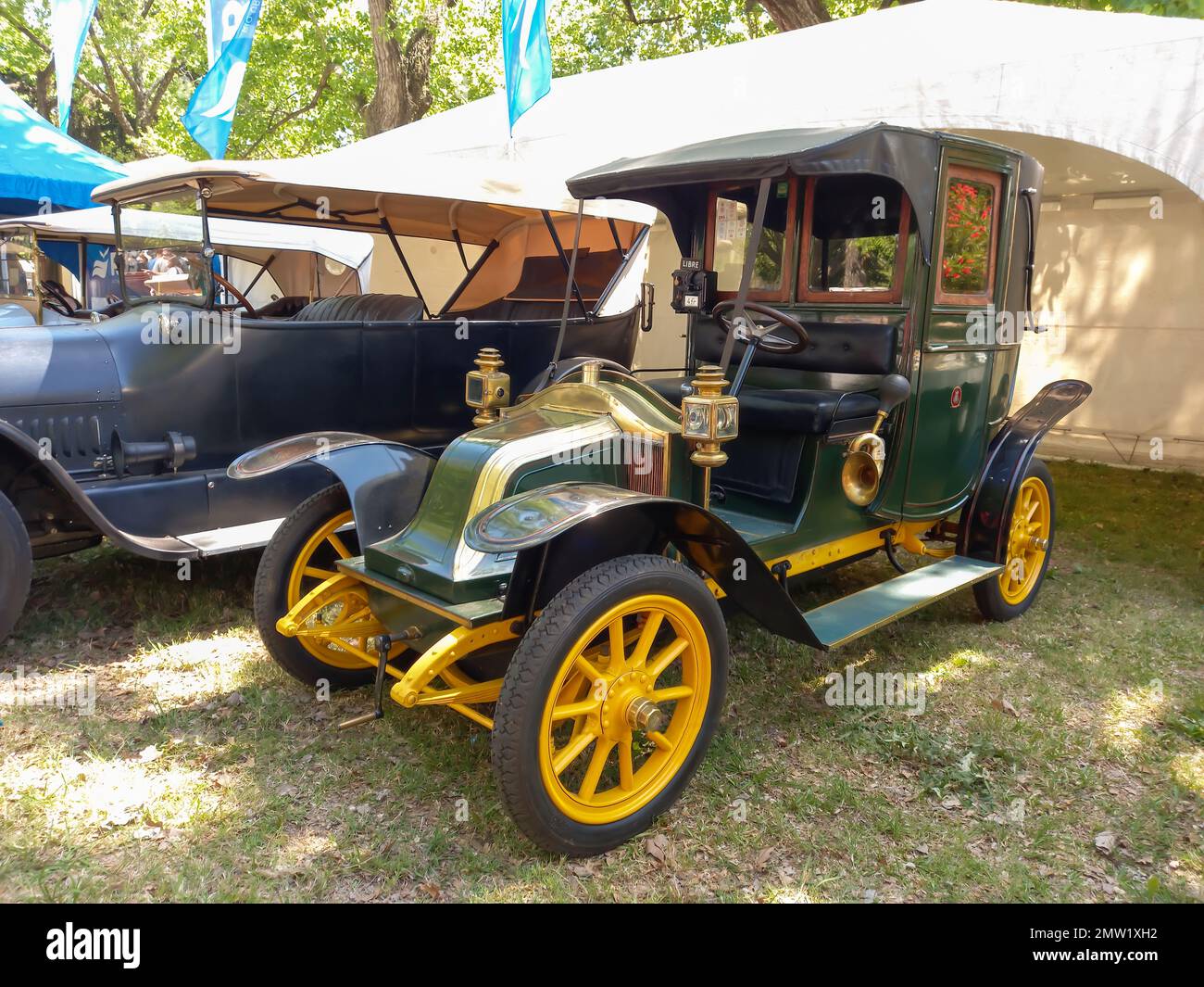 Old antique 1910s Renault Type AG cab Taxi de la Marne in a park. Nature, grass, trees. Autoclasica 2022 classic car show. Stock Photo