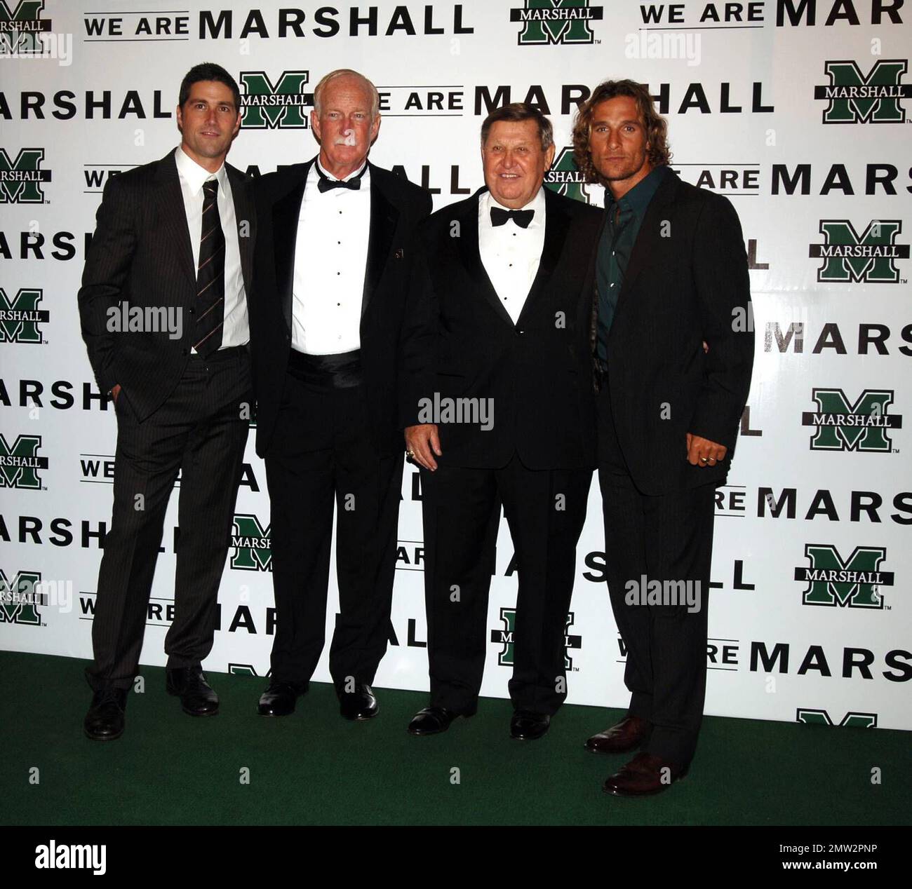 Actor Matthew Fox, left, former Marshall coach Red Dawson, former Marshall  head coach Jack Lengyel, and actor Matthew McConaughey set up a photo op on  the green carpet during the premiere of 