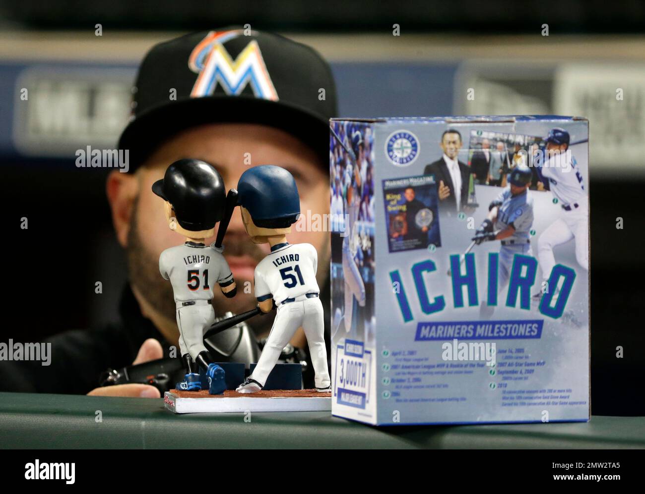 A dual bobble head showing Miami Marlins' Ichiro Suzuki wearing a Marlins  jersey and a jersey from his former team, the Seattle Mariners, and  commemorating his 3,000-hit milestone, is shown before a