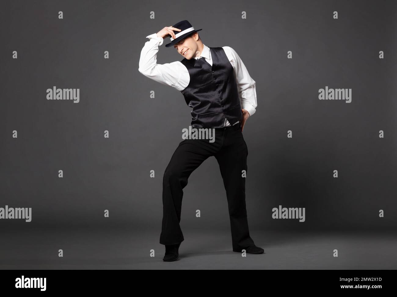 Men's Beauty, Fashion. Retro Style. Handsome Man In An Expensive  Three-piece Suit, A Cap And Leather Gloves On A Black Background. Mafia  Man. Stock Photo, Picture and Royalty Free Image. Image 158258662.