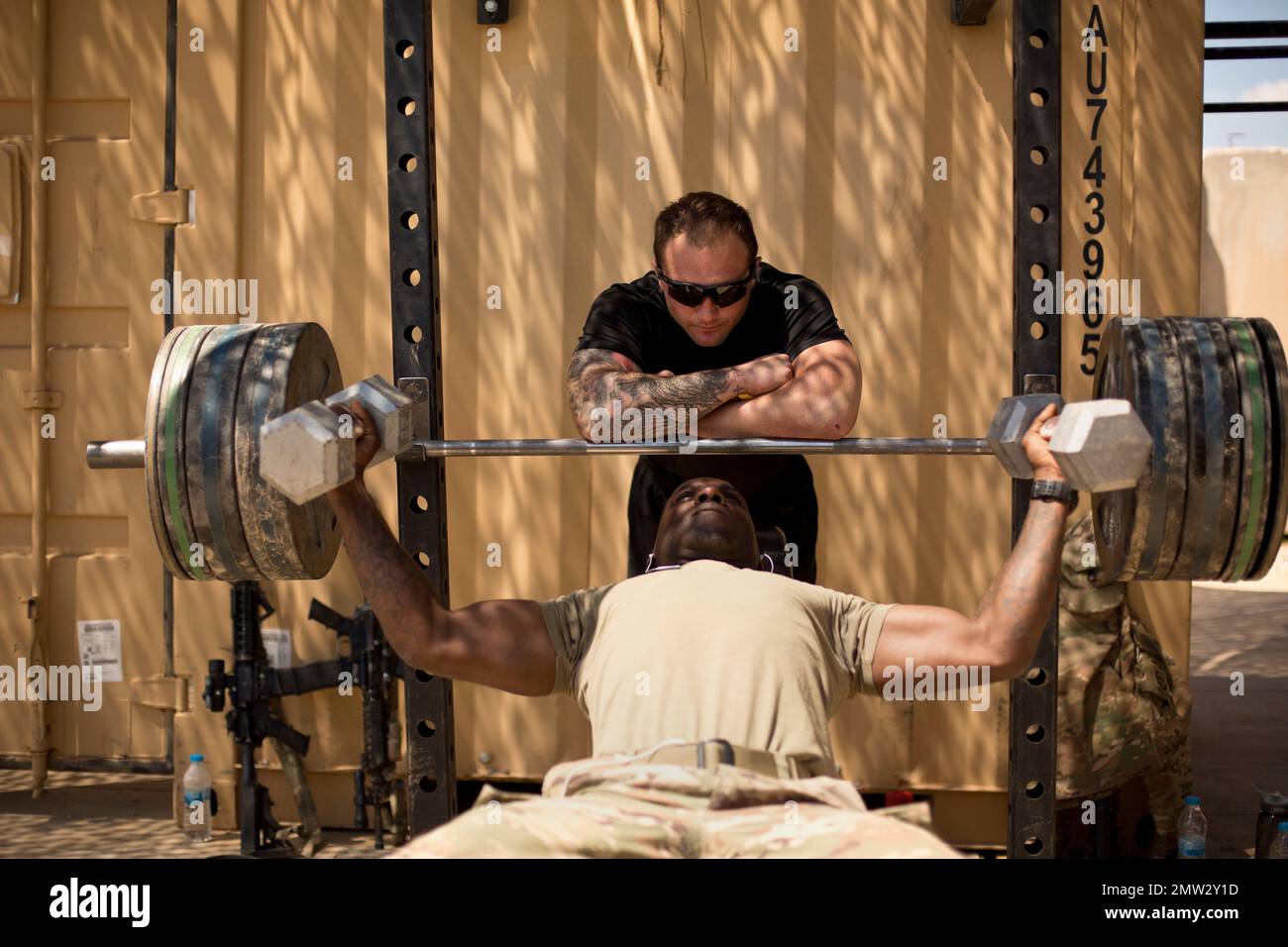 U.S. soldiers from the 82nd Airborne Division lift weights on their ...