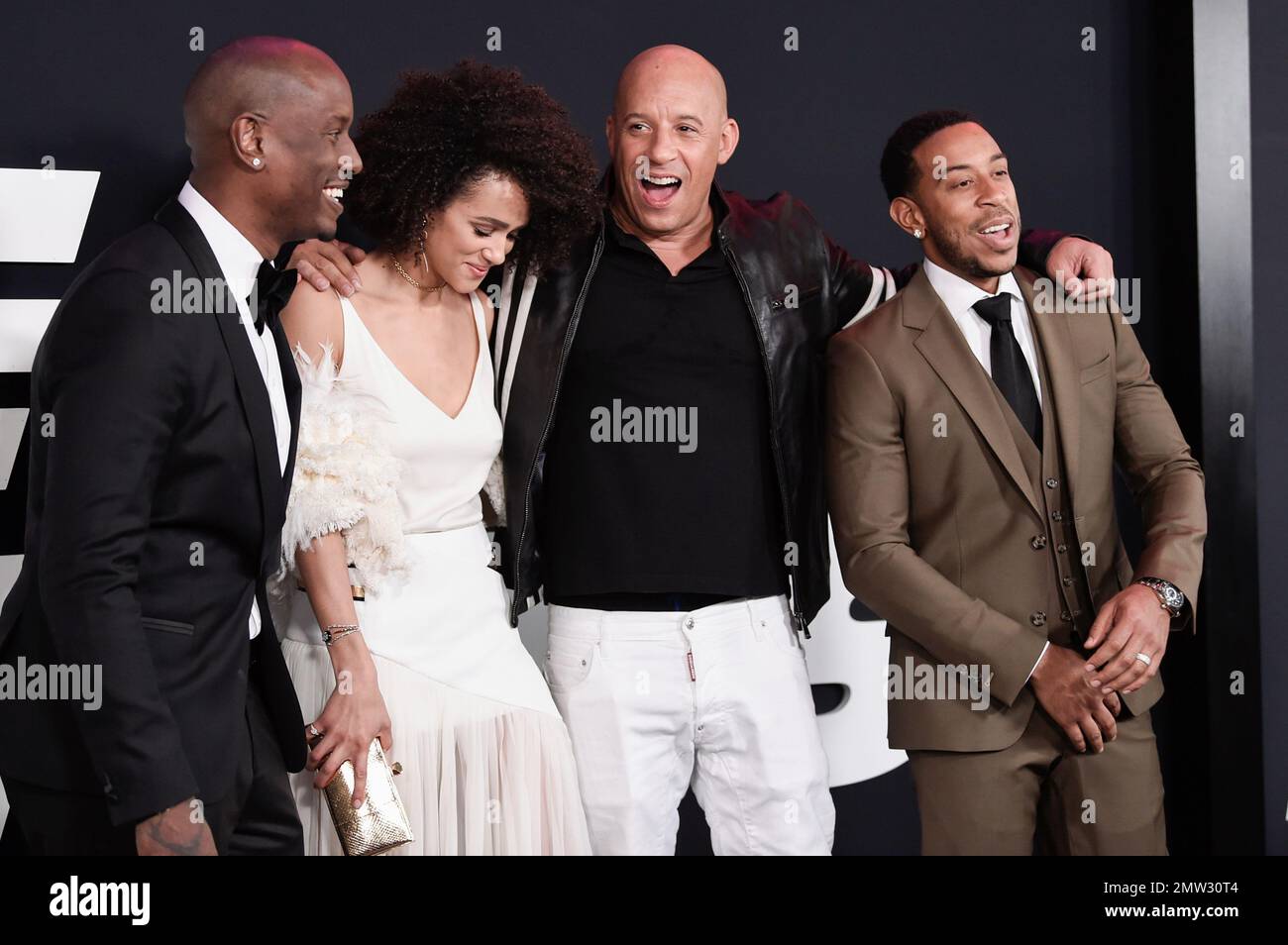 Actors Tyrese Gibson, left, Nathalie Emmanuel, Vin Diesel and Chris