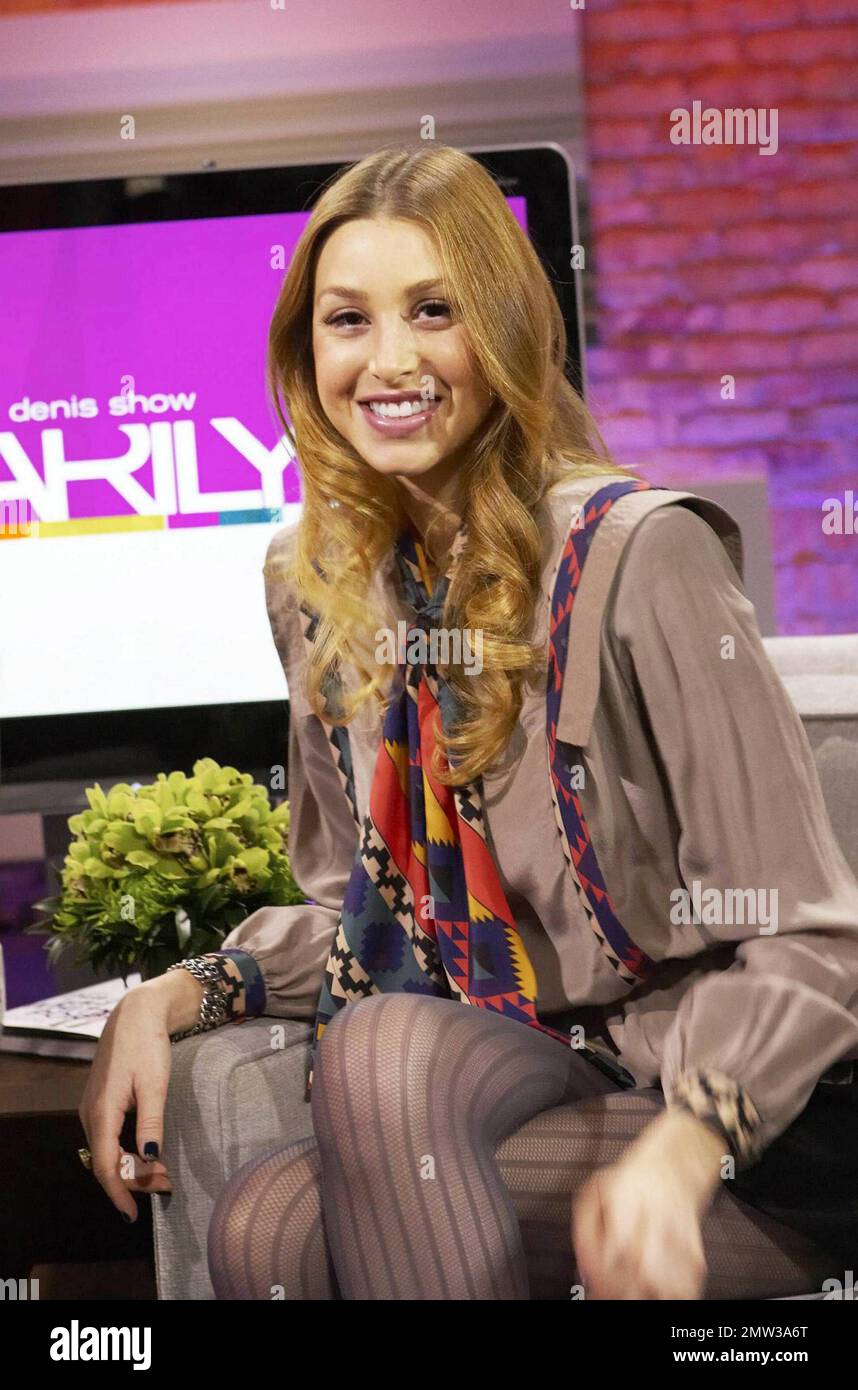 In a patterned scarf, tan blouse and mini skirt reality TV star Whitney Port laughs and smiles as she appears on the Canadian talk show 'The Marilyn Denis Show' where she promoted her new book True Whit: Designing a Life of Style, Beauty, and Fun and discussed pieces from her clothing line Whitney Eve which were modeled. Toronto, ON. 01/31/11. Stock Photo
