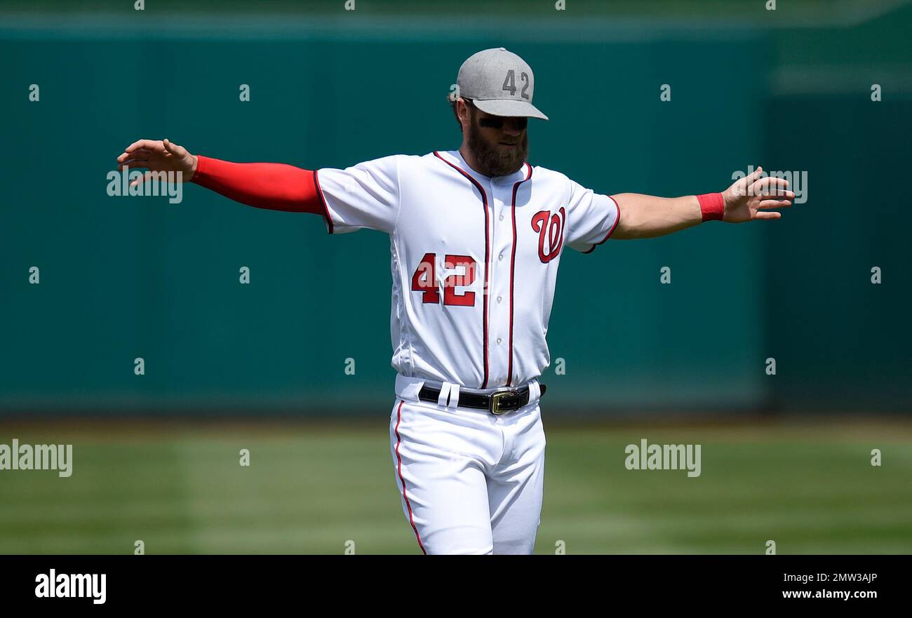 Washington Nationals' Bryce Harper wears a No. 42 hat in tribute to Jackie  Robinson as he warms up before a baseball game against the Philadelphia  Phillies, Saturday, April 15, 2017, in Washington. (