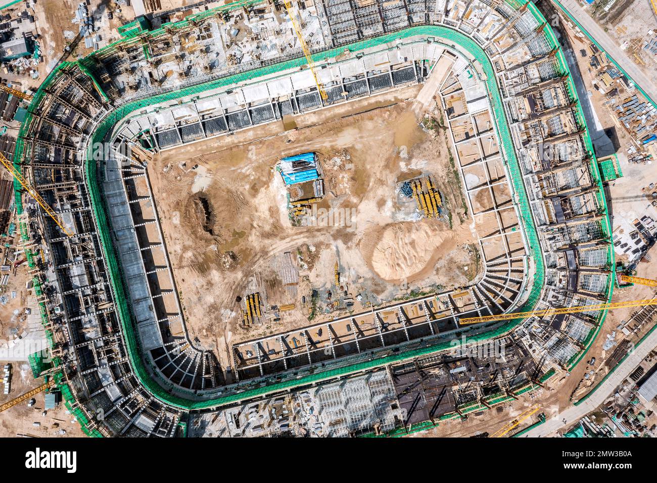 aerial top view of big construction site. new football stadium under