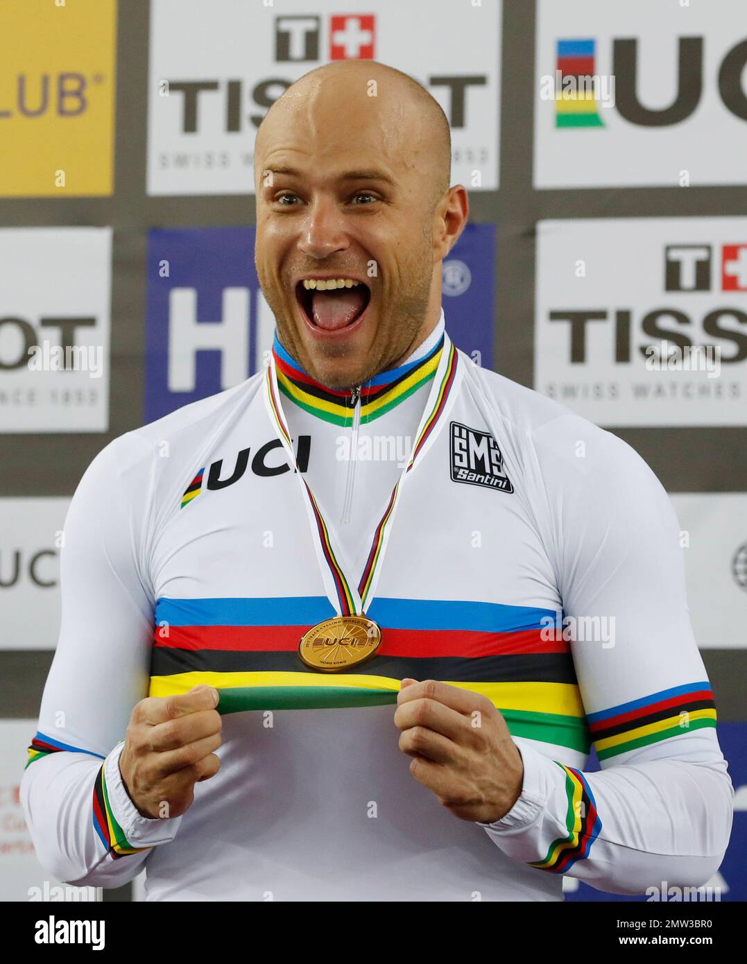 Russia's Denis Dmitriev celebrates on the podium after winning the men