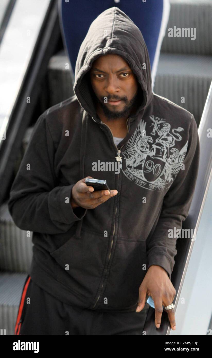 EXCLUSIVE Black Eyed Peas musician Will.i.am wears a black hoodie as he chats on his cellphone while leaving his gym in West Hollywood CA. 1 24 11 Stock Photo Alamy