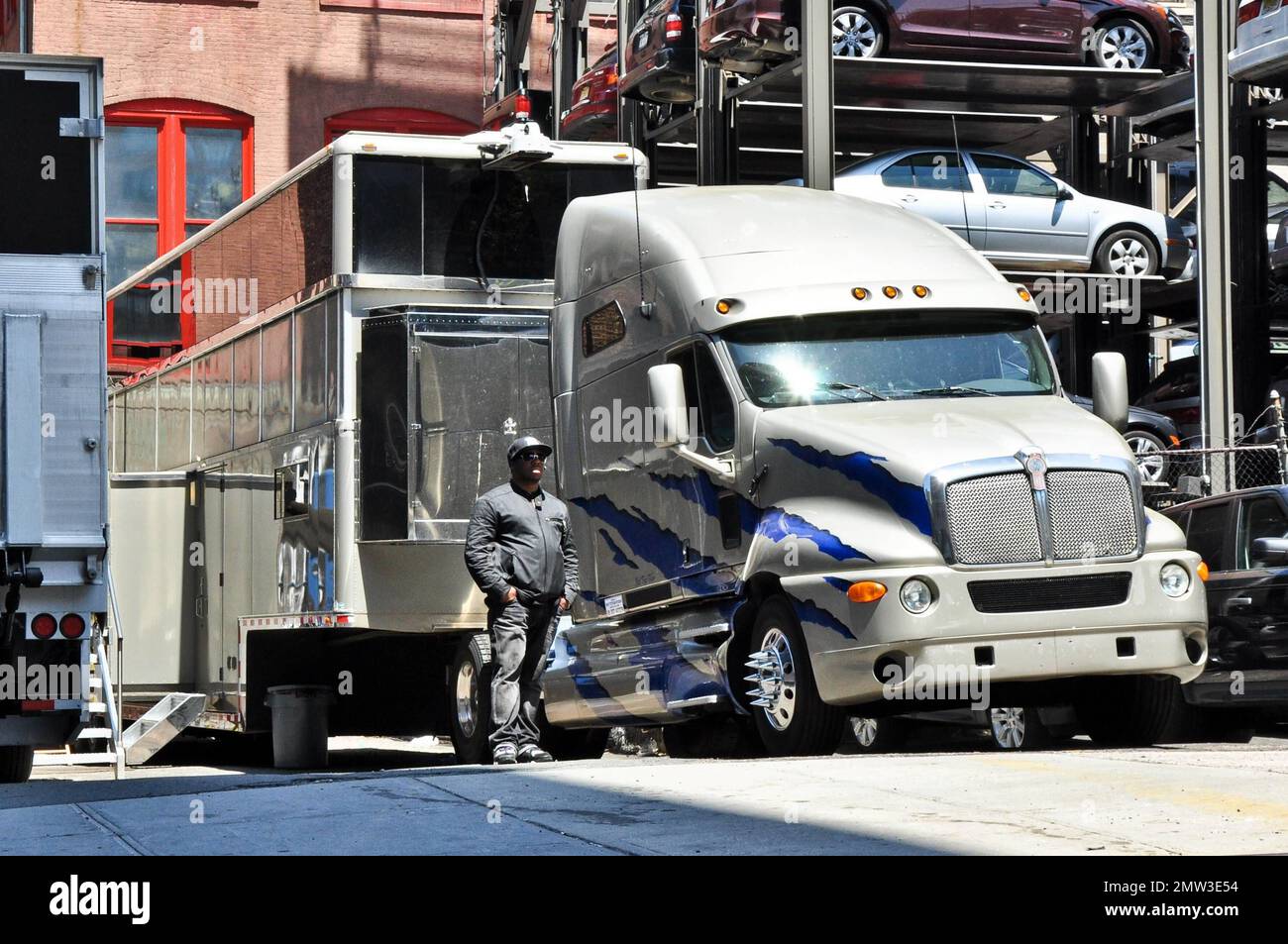 https://c8.alamy.com/comp/2MW3E54/will-smiths-giant-2-million-trailer-has-been-moved-from-the-soho-neighborhood-where-the-actor-is-filming-men-in-black-3-after-reported-complaints-from-neighborhood-residents-about-it-blocking-streets-and-ruining-their-views-the-trailer-was-relocated-to-this-parking-area-nearby-the-giant-trailer-reportedly-holds-1150-squre-feet-and-features-2-bedrooms-and-2-bathrooms-along-with-a-full-kitchen-with-granite-and-italian-cherry-wood-the-two-story-trailer-also-features-a-bar-and-an-office-big-enough-for-30-people-on-the-upper-level-according-to-reports-smith-has-a-separate-55-foot-traile-2MW3E54.jpg
