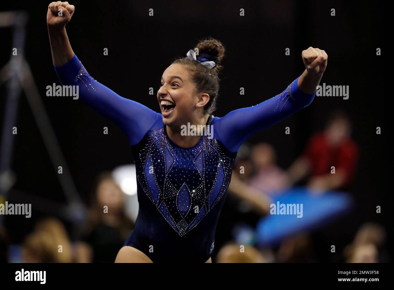 Florida's Rachel Slocum celebrates after competing on the vault during