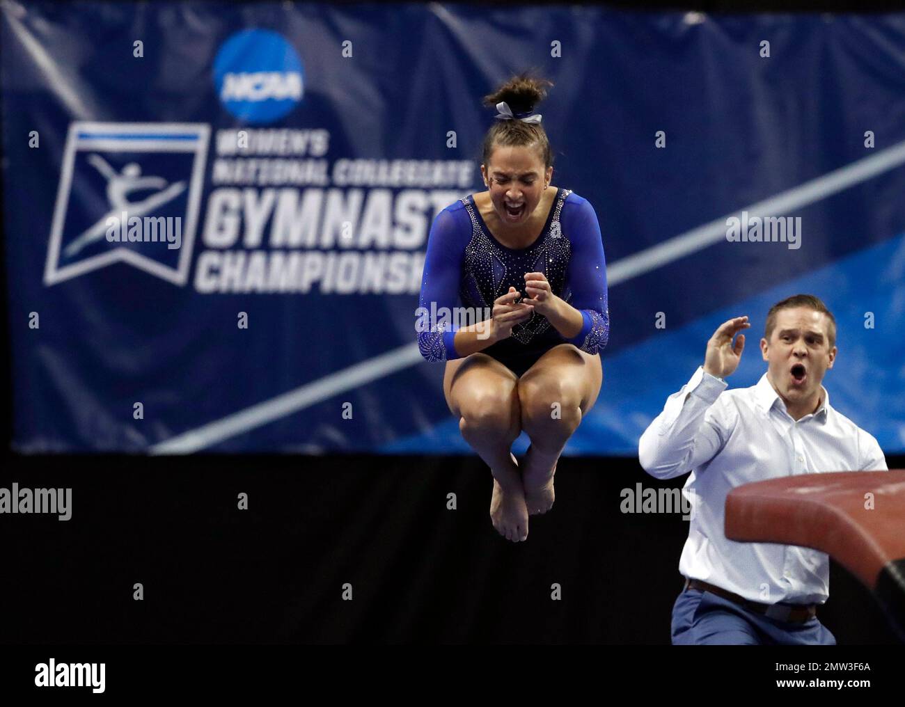 Florida's Rachel Slocum celebrates after competing on the vault during
