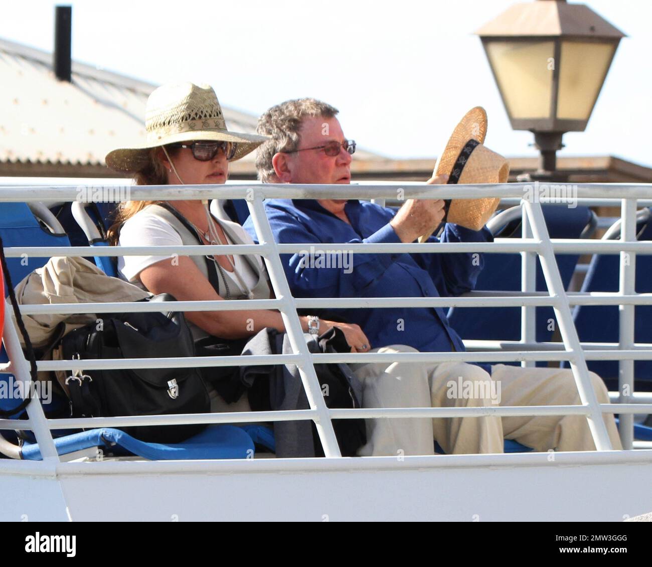 EXCLUSIVE!! Actor William Shatner and wife Elizabeth Martin are seen boarding a boat whilst on holiday in Hawaii.   The star worldly recognized as Captain Kirk of the 'Star Trek' series, tried to stay incognito under a Panama hat whilst boarding the boat with luggage and a bag full of water noodles.  Shatner, 80, is reportedly headed to Broadway again.  His one man show, 'Shatner's World: We Just Live In It' will debut in February 2012 for a brief run at the Music Box Theatre on Broadway. The show which Shatner wrote himself, will kick off a 15-week national tour and is based on the years of f Stock Photo