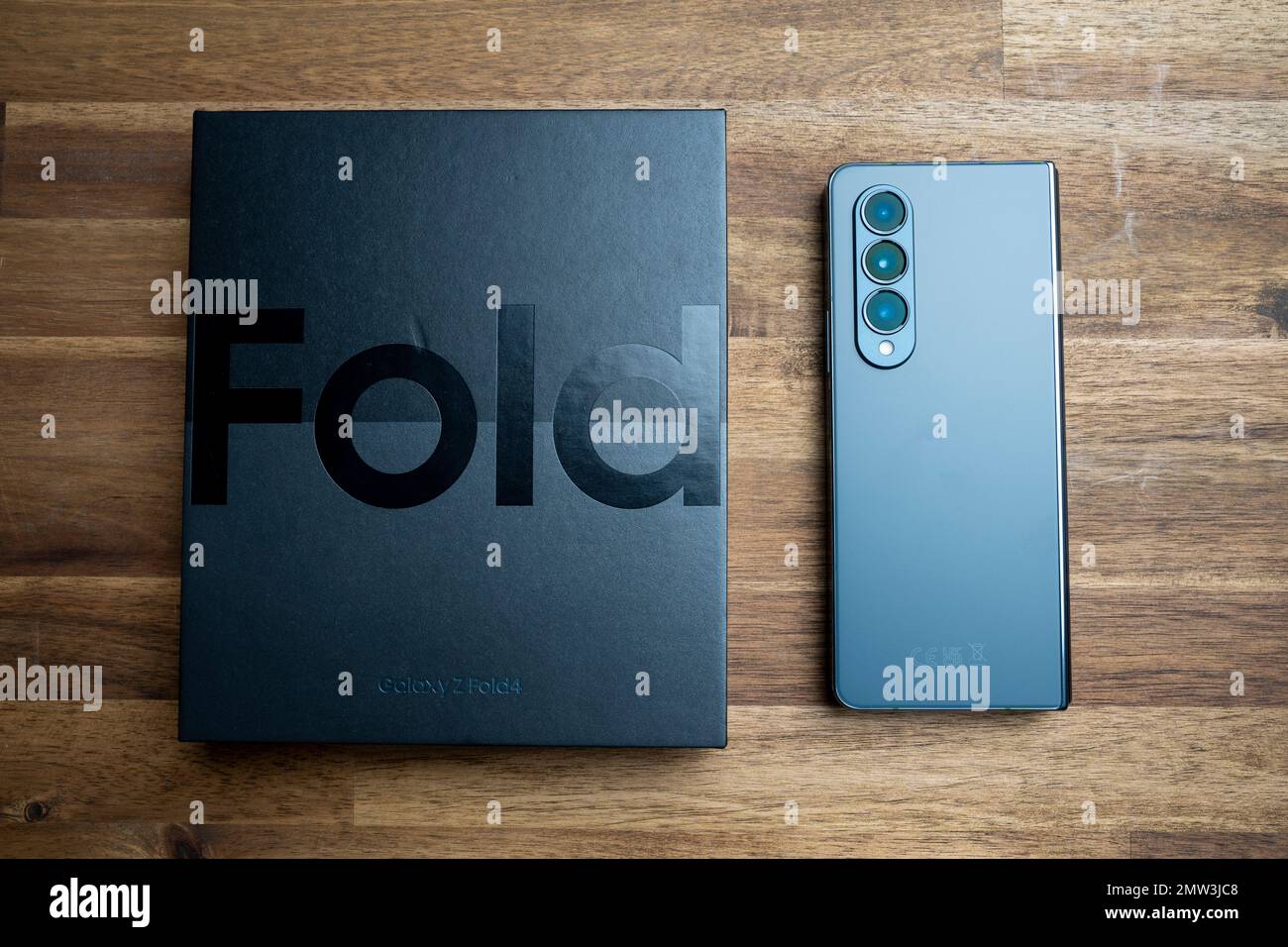 Brand new Samsung Galaxy Z Fold 4 in grey-green color. The device is in the closed position. Stock Photo