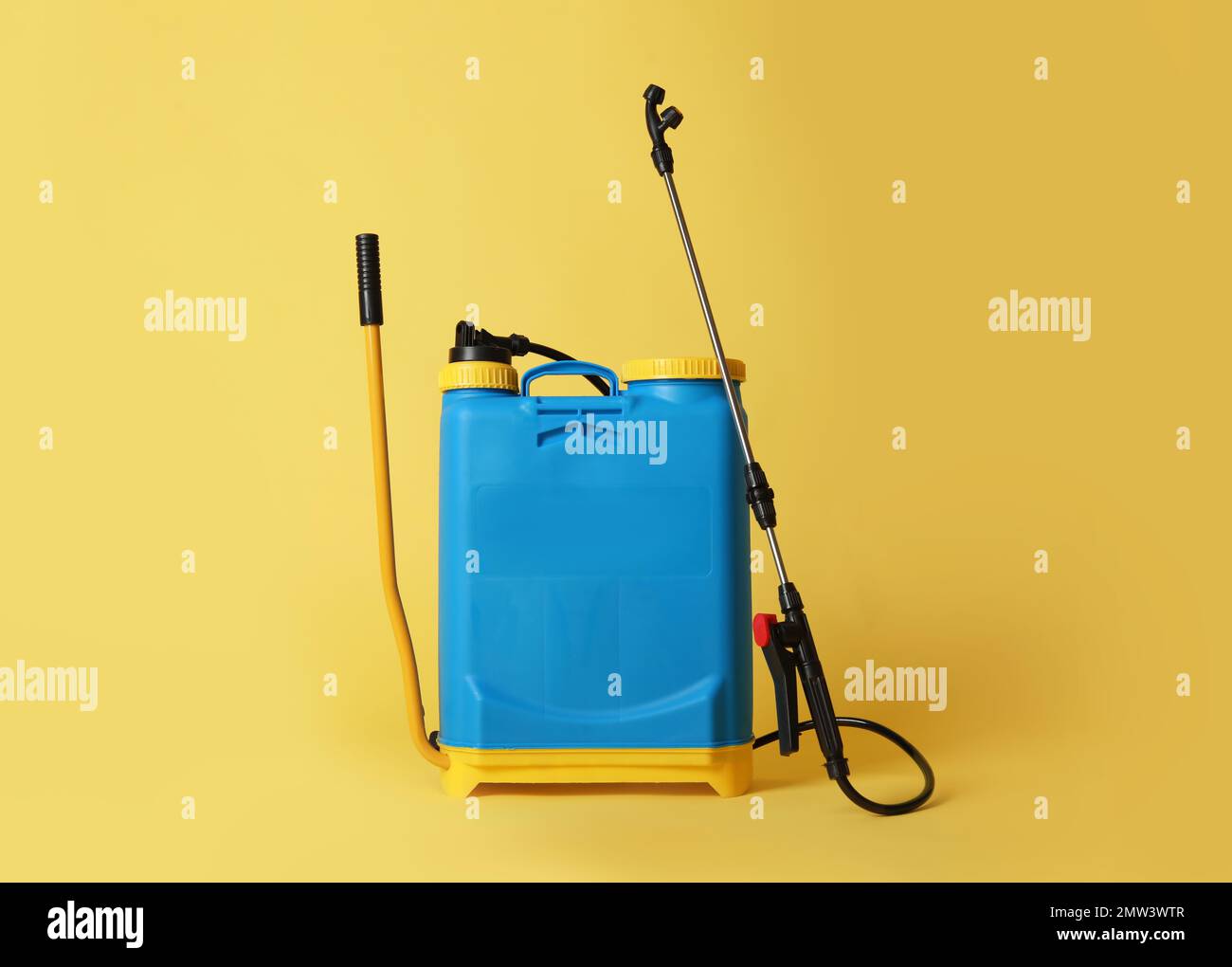 Manual insecticide sprayer on yellow background. Pest control Stock ...