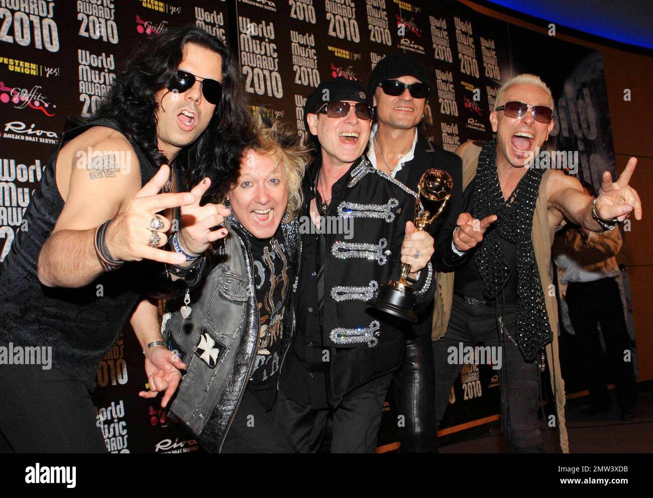 Pawel Maciwoda, James Kottak, Klaus Meine, Matthias Jabs and Rudolf Schenker of the German rock band Scorpions pose with their award at the Sporting Club Monte-Carlo after the annual World Music Awards 2010.  The award show, which was founded in 1989 to honor international recording artists based on worldwide sales figures, was hosted by actresses Michelle Rodriguez and Hayden Panettiere.  Musicians who performed at the event included Jennifer Lopez, Akon, 50 Cent and Scorpions. Monte Carlo, Monaco. 05/18/10. Stock Photo