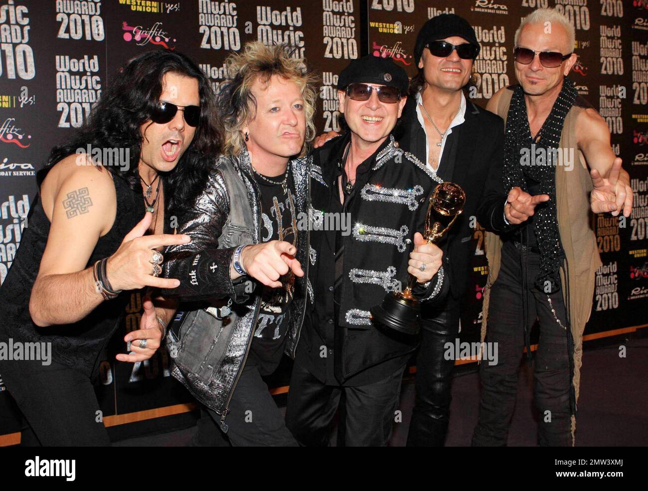 Pawel Maciwoda, James Kottak, Klaus Meine, Matthias Jabs and Rudolf Schenker of the German rock band Scorpions pose with their award at the Sporting Club Monte-Carlo after the annual World Music Awards 2010.  The award show, which was founded in 1989 to honor international recording artists based on worldwide sales figures, was hosted by actresses Michelle Rodriguez and Hayden Panettiere.  Musicians who performed at the event included Jennifer Lopez, Akon, 50 Cent and Scorpions. Monte Carlo, Monaco. 05/18/10.   . Stock Photo