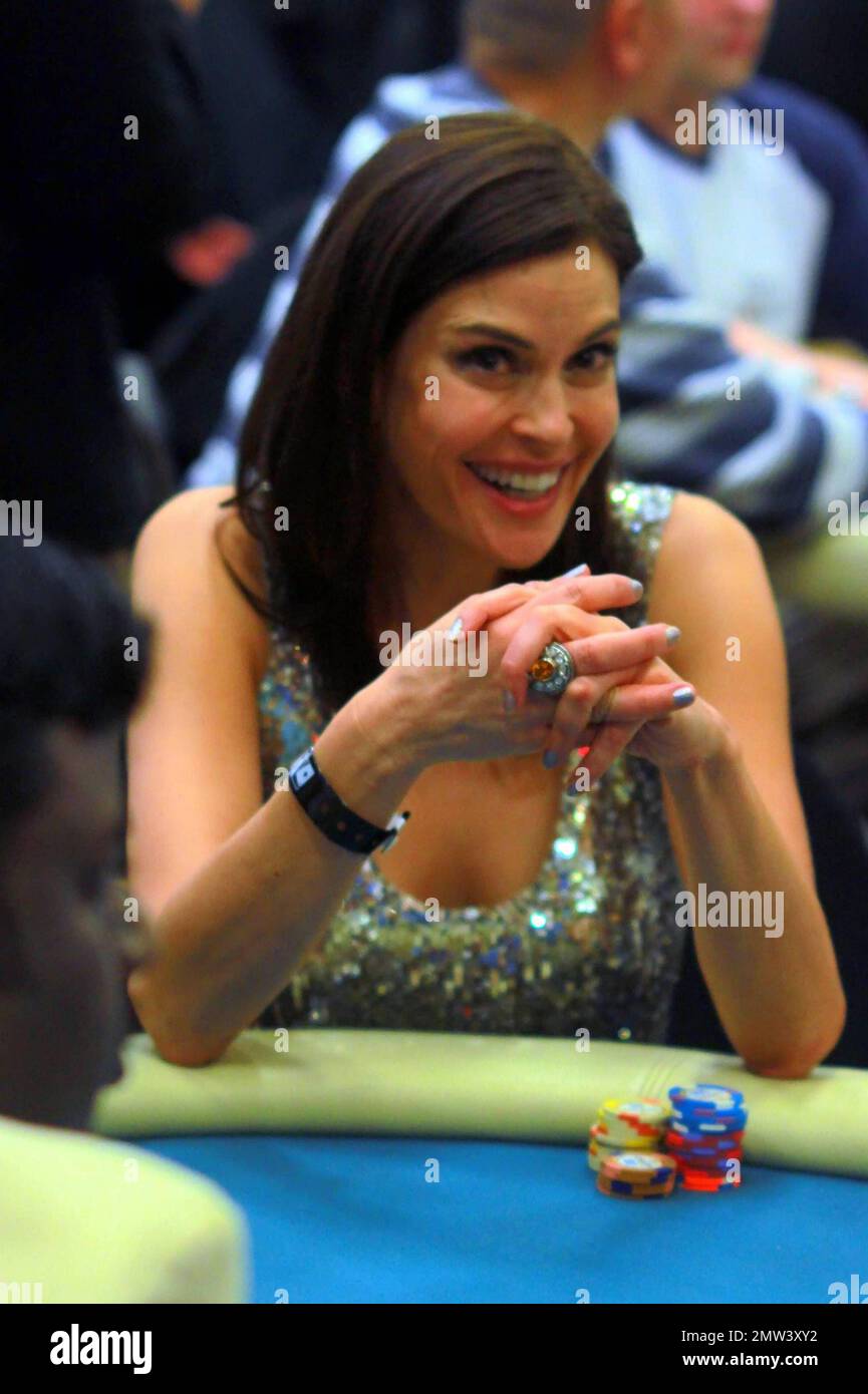 Teri Hatcher laughs as she plays at the 8th Annual World Poker Tour Invitational Texas Hold 'Em poker tournament for the Chrysalis Charity, a non-profit organization dedicated to helping homeless and economically disadvantaged individuals become self-sufficient through employment opportunities, at the Commerce Casino, in Los Angeles, California, 02/20/10. Stock Photo