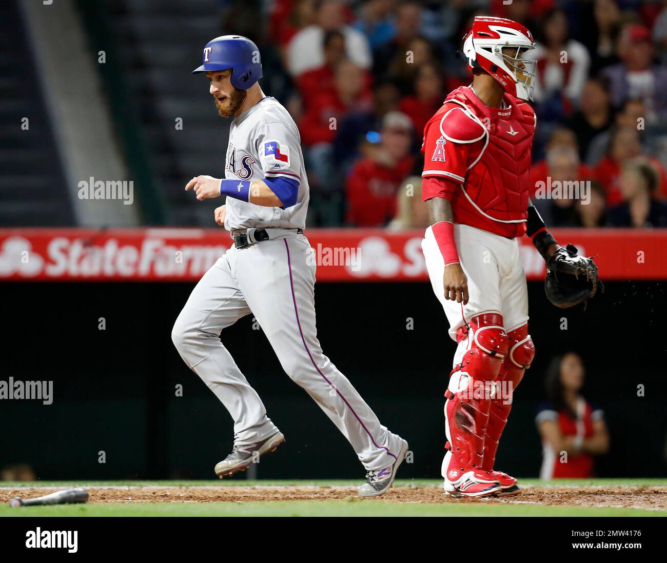Texas Rangers' Jonathan Lucroy, left, scores on an RBI double by Joey ...