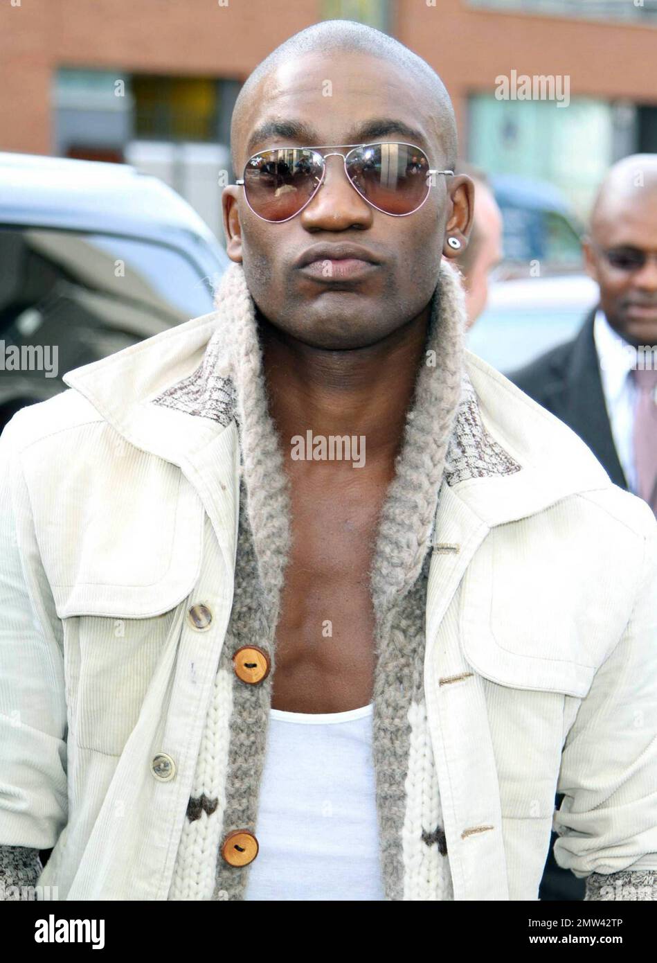 Kalvin Lamey of FYD, an 'X Factor' finalist band, leaves ITV studios after appearing on the morning talk show GMTV alongside other 'X Factor' contestants. London, UK. 10/07/10. Stock Photo