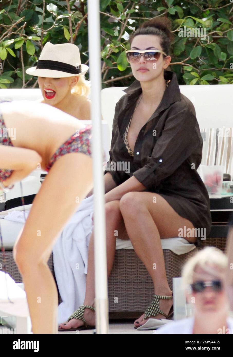 Christina Aguilera joins good pal Simone Harouche poolside at the  Fontainebleau Miami Beach for her bachelorette party. Also on hand to join  in the fun was bikini clad Kim Kardashian. The singer