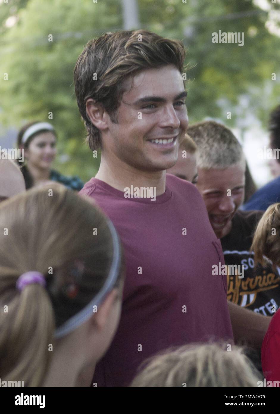 Zac Efron looks to be having a great time posing for photos with fans