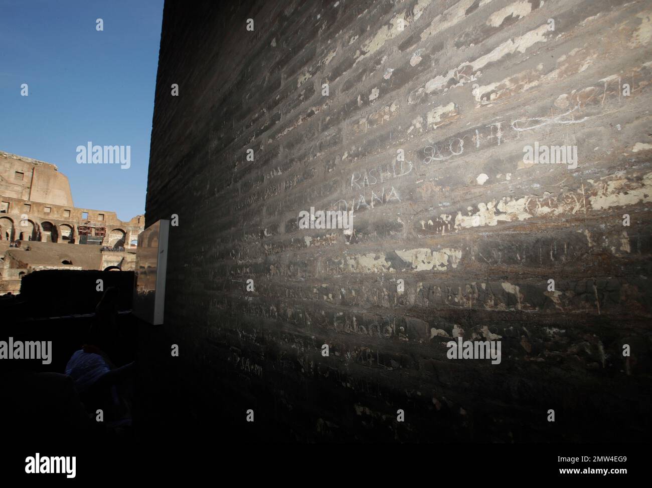 A view of a writing inscribed on a wall inside the Colosseum, Tuesday ...