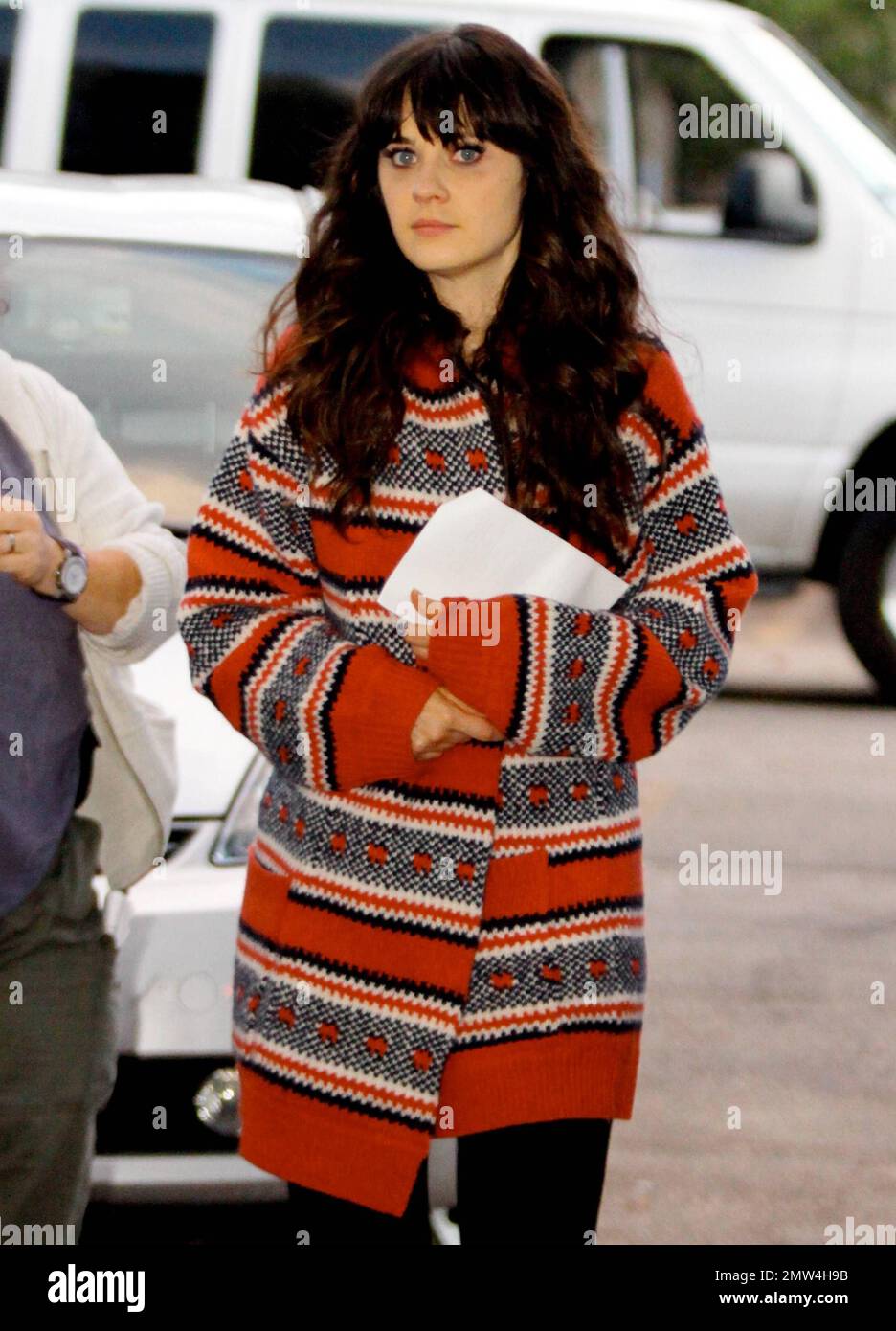 EXCLUSIVE Zooey Deschanel wears a patterned jacket and brown