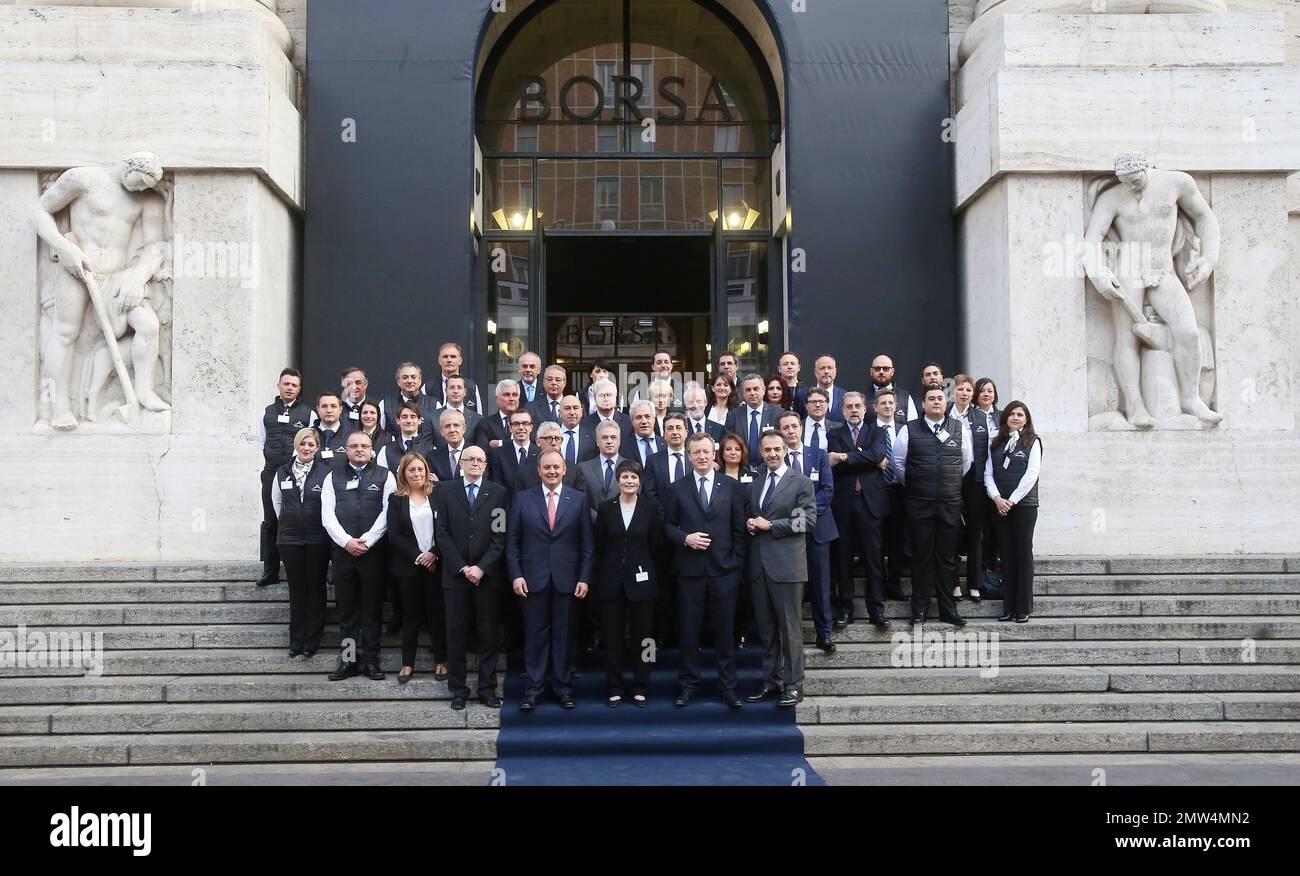 Avio CEO managers and workers pose in front of Milan's stock exchange  during the official ceremony for satellite rocket launcher Avio listing at  a Milan stock exchange event, in Milan, Italy, Monday,