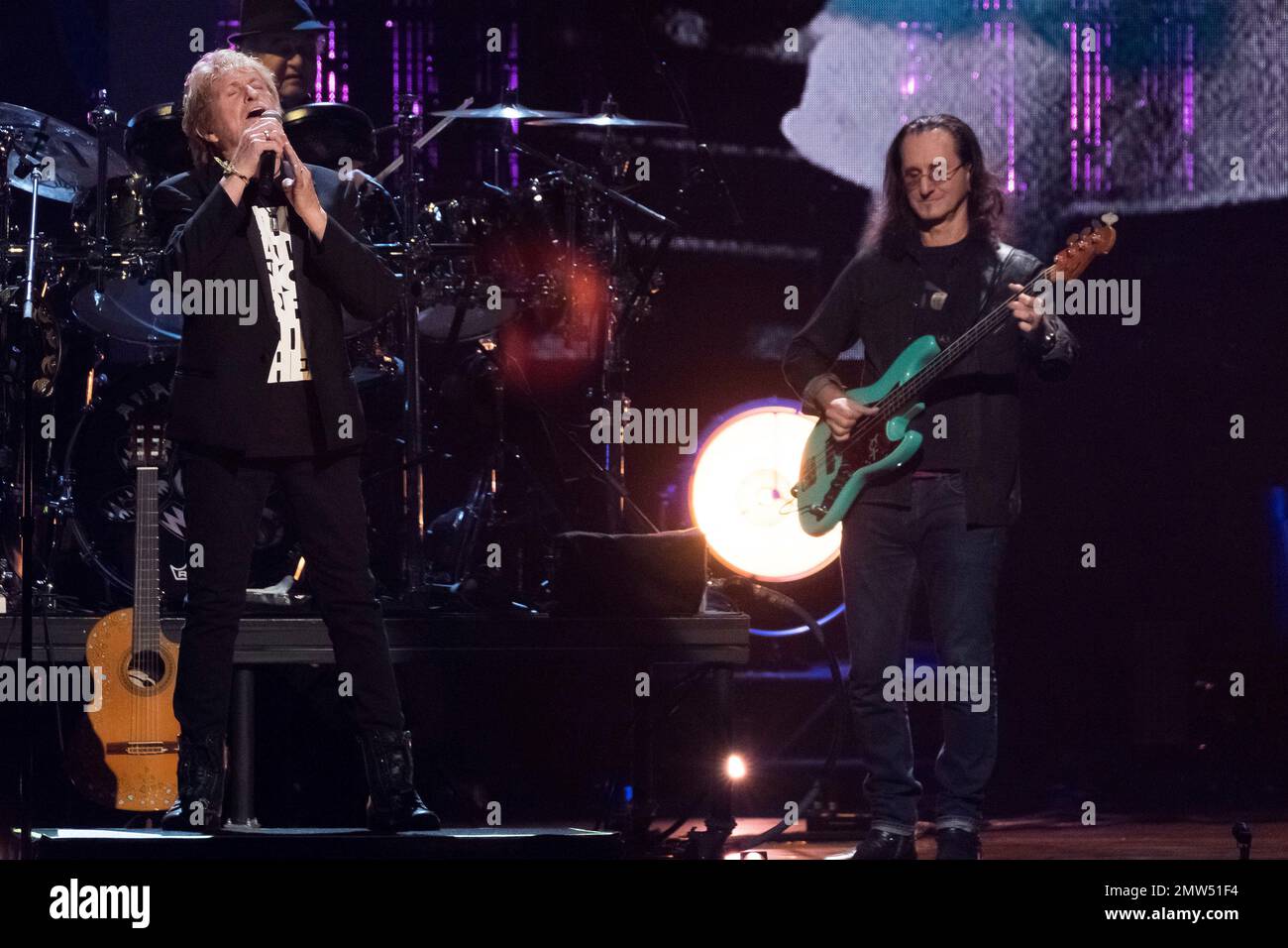 Inductee Jon Anderson from the band Yes, left, and Geddy Lee from the