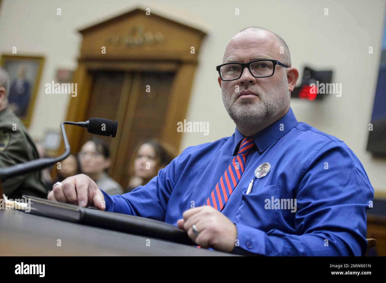 Washington, United States. 01st Feb, 2023. Brandon Dunn, co-founder of Forever 15 Project, looks on during a House Judiciary Committee hearing examining border security, national security, and the impact of fentanyl on Americans at the U.S. Capitol in Washington, DC on Wednesday, February 1, 2023. Dunn and his wife, Janel, founded the non-profit organization to spread awareness of the fentanyl epidemic after their 15-year-old son Noah died from fentanyl poisoning in 2022. Photo by Bonnie Cash/UPI Credit: UPI/Alamy Live News Stock Photo