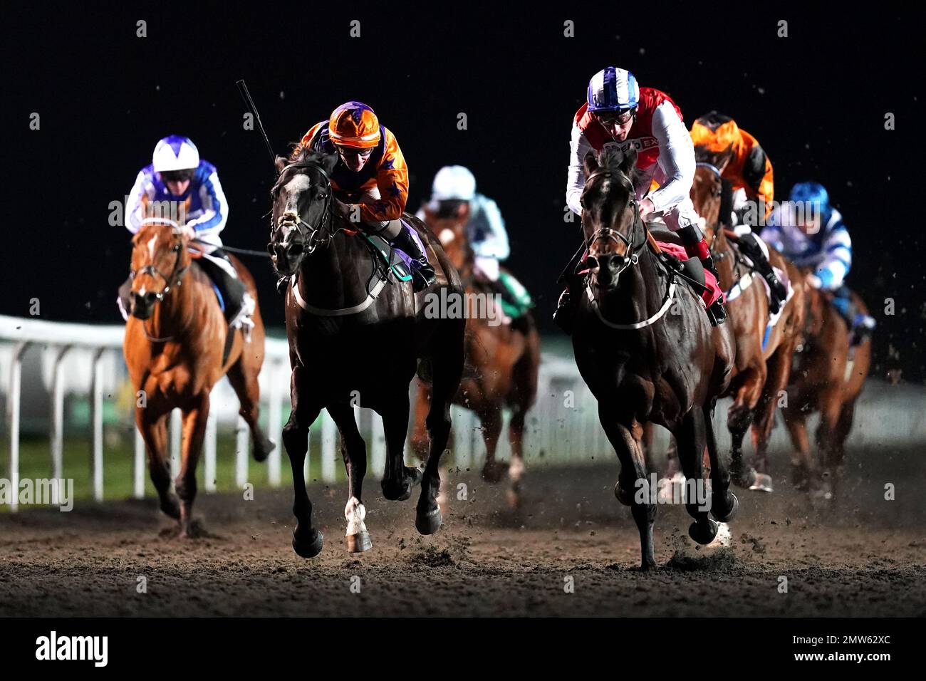 Positive ridden by jockey Adam Kirby (right) wins the Unibet 3 Uniboosts a Day Handicap with Naval Commander ridden by jockey Kieran O'Neill second at Kempton Park Racecourse, Sunbury-on-Thames, Surrey. Picture date: Wednesday February 1, 2023. Stock Photo