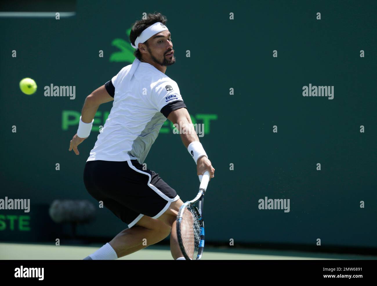 Fabio Fognini, of Italy, hits a return to Rafael Nadal, of Spain, during a mens semifinal match at the Miami Open tennis tournament, Friday, March 31, 2017, in Key Biscayne, Fla